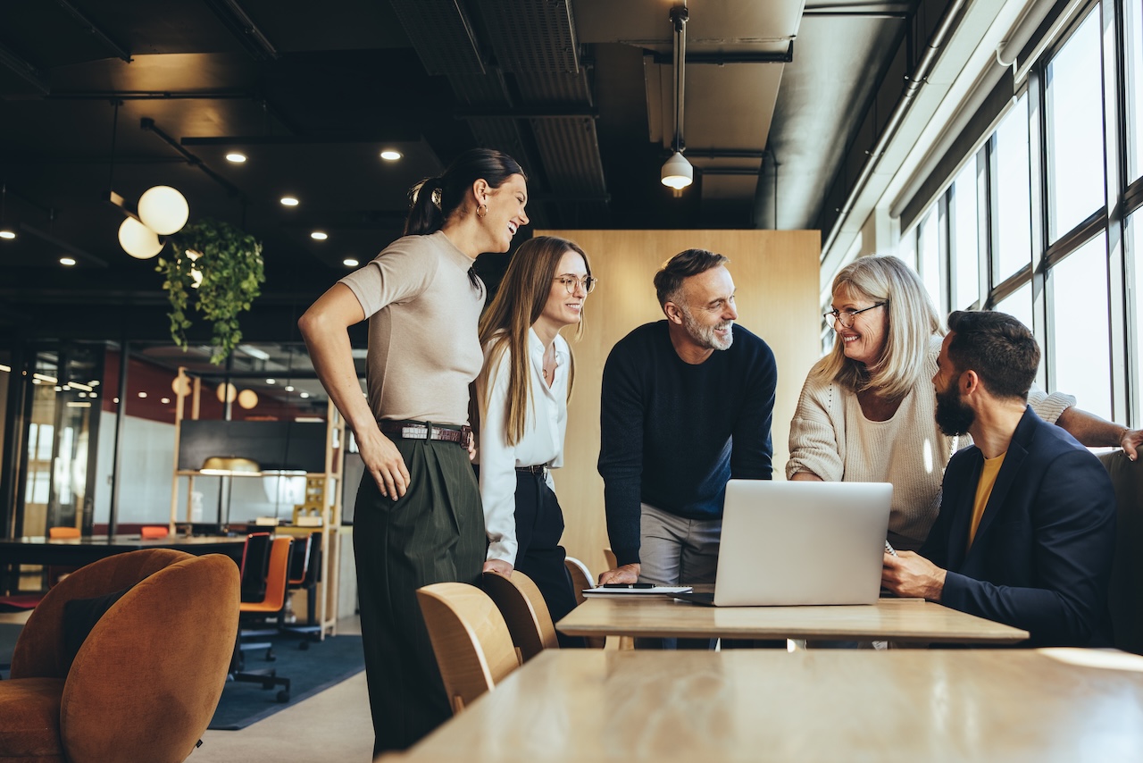 Business team collaborating and smiling during a presentation meeting