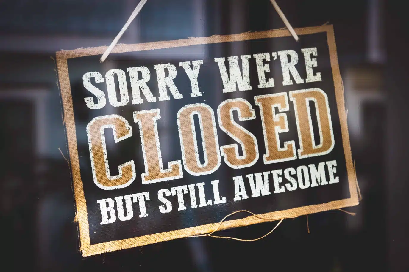 Closed sign that reads "Sorry we’re closed but still awesome"