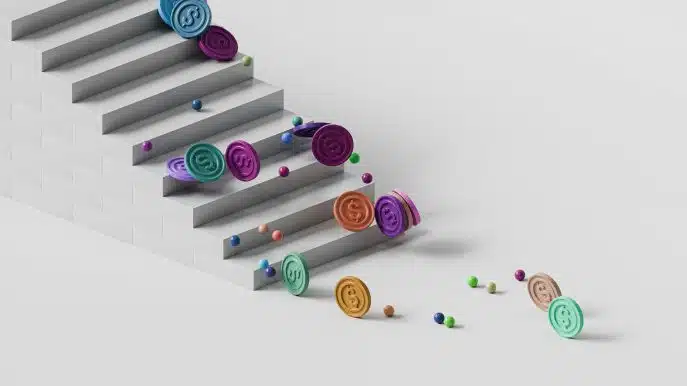 Colorful coins and balls rolling down minimalist white stairs on a light background.