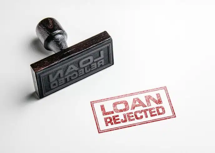 Rubber stamp imprint reading "Loan Rejected" on white paper